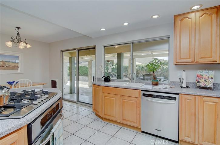 Enjoy the benefits of wood cabinetry and stainless steel appliances in this kitchen.