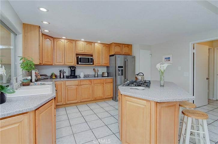 Any chef will be at home here...check out all the cabinet and counter space...breakfast bar is the perfect place to hang out and watch the magic happen!