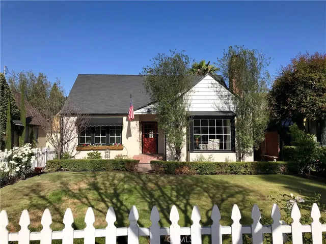 Charming English Cottage built in 1941 tucked behind a picket fence.