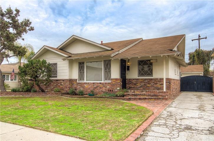 Front of home with extra long driveway.