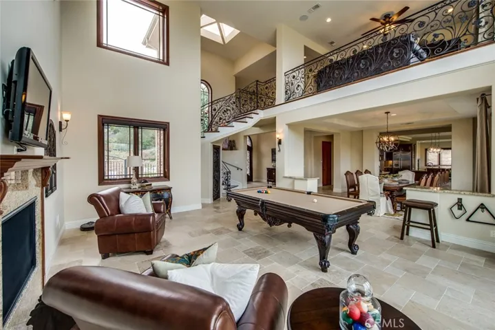 This view is from the corner closest to the windows and takes in the entry and staircase.