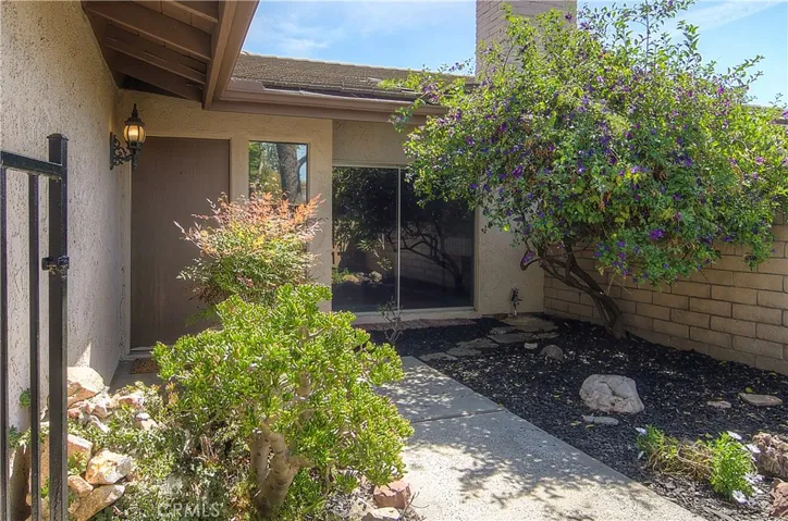 Private entry courtyard is the perfect place to stop and take a breath after a long hard day...or adds to the Southern California indoor/outdoor lifestyle with large sliding glass door.