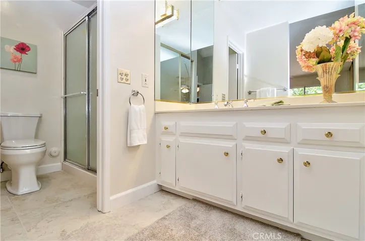 Nice ensuite master bath has separate vanity area with lots of storage and large shower.