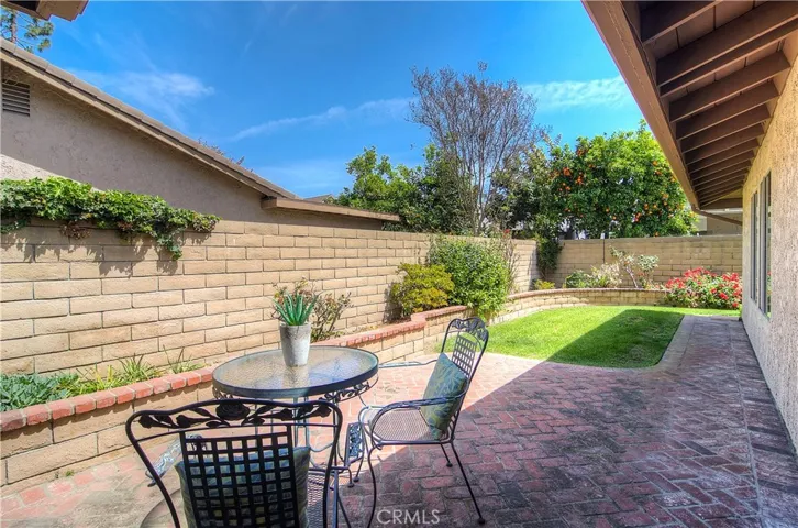 This yard is the perfect size...plenty of room for grass, landscaped planter areas, and nice brick patio for entertaining.