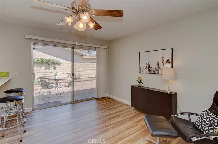 Huge slider to side yard from family room makes easy access for dining alfresco.