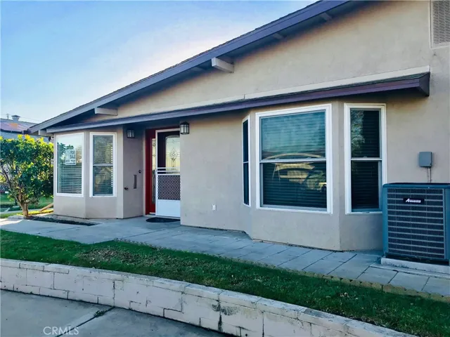 This fully expanded Leisure World home features bay windows and drive-up parking