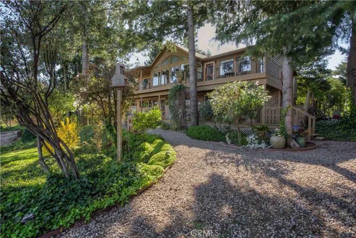 Set among the tall Pines and Oaks is this stunning Craftsman Style Dream home!