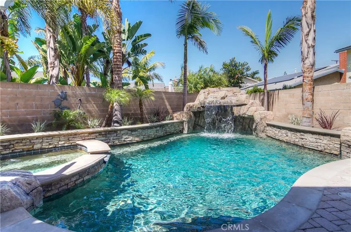 Pebble Tec Pool with Watertfall & Huge Spa Only Hint at the Amenities Of This Yard.