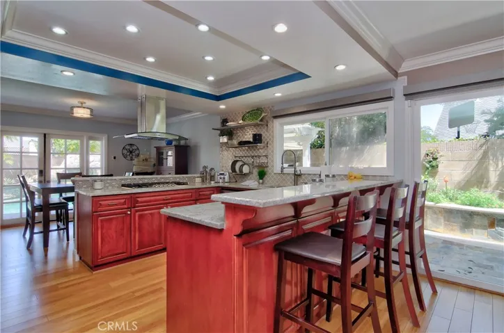 Seating Abounds with 2 Bars and Formal Dining. Sparkling New Tile and Counters!