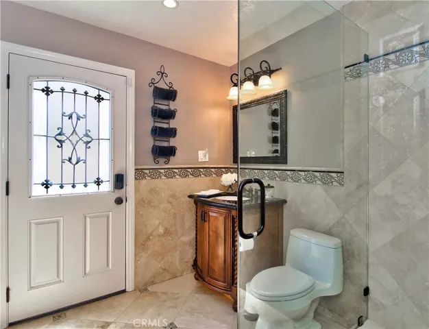 Downstairs 3/4 bath with easy access ot the pool and yard, perfect.