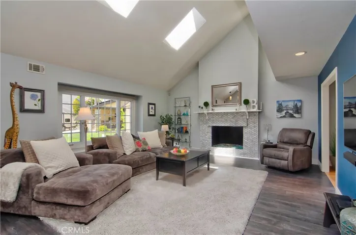 Wow is right!  This is a beautiful space...gorgeous fireplace is the heart of the room.