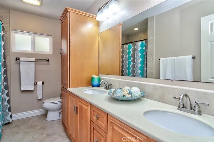 Roomy hall bath is perfectly positioned between additional bedrooms and has plenty of sink, counter and STORAGE space.