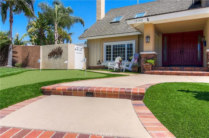 Let's Tour...Beginning With The Pristine Front Yard & Brick Lined Approach Walk...PLUS Traditional Covered  Porch With Double Door Entry.