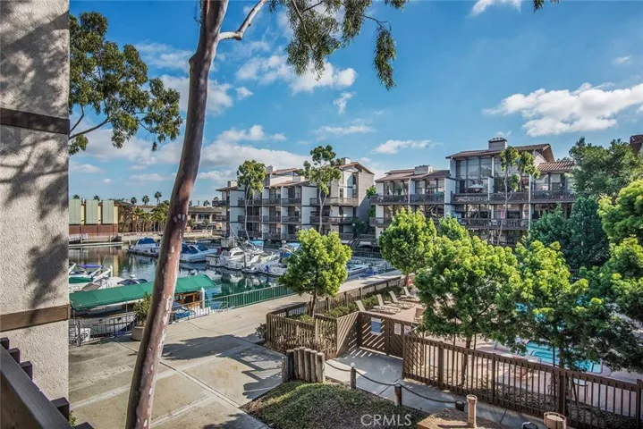 View of the picturesque marina and pool area from your private 35' balcony!