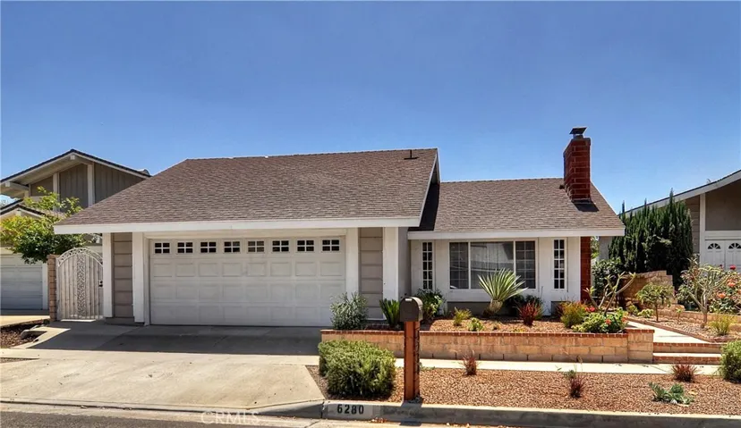 Front View Featuring Beautifully Manicured Yard with Drought Tolerant Landscaping