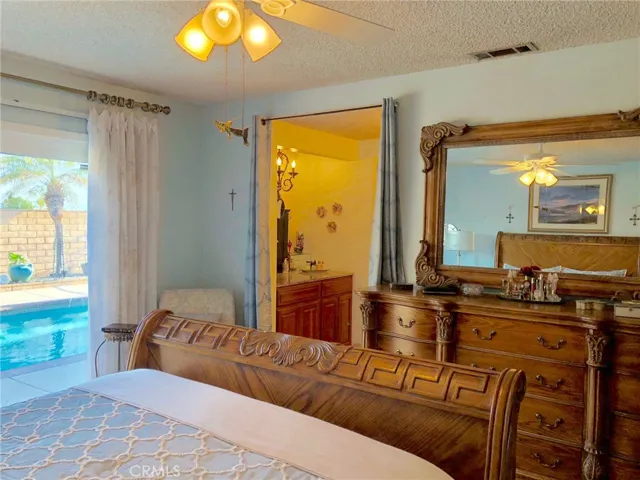 Master w/view of master vanity and pool