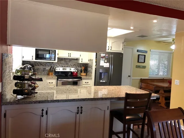 Kitchen from dining w/extra storage