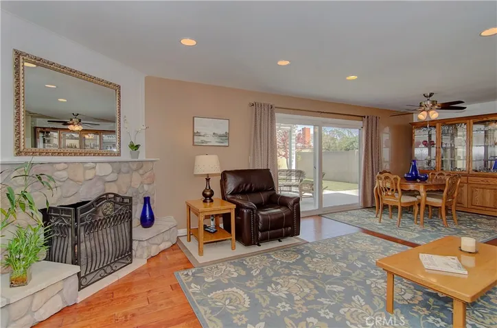 Great room has it all...beautiful stone fireplace, large dining area and slider to rear yard.