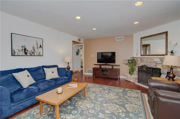 Living area is large enough to accommodate many furniture options...beautiful hardwood flooring is in most areas of the home...no laminate or vinyl here!