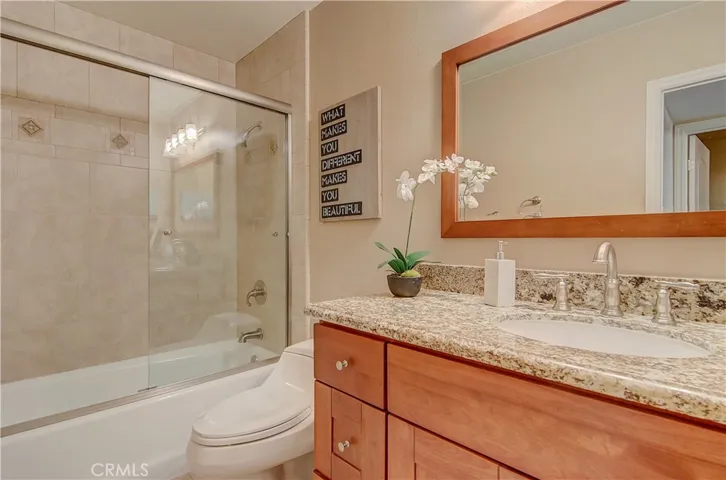 This upstairs hall bath has tasteful, decorator elements.