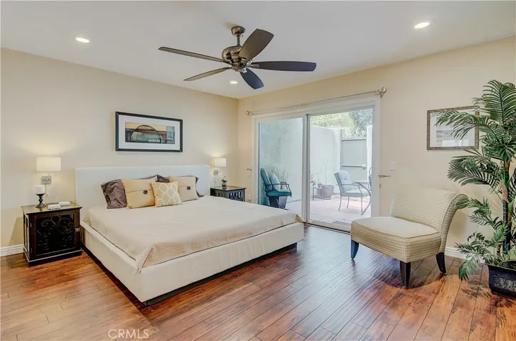 Huge master suite has plenty of room for king size bed...plus slider to private patio area.