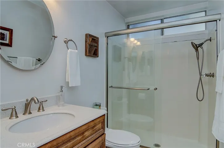 Updated Master bath has large shower and upgraded fixtures with contemporary finishes.
