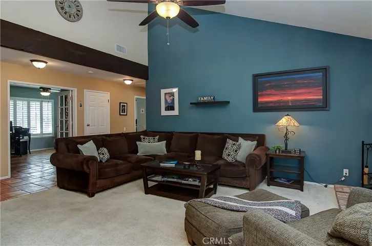 Spacious living area with vaulted ceiling has plenty of room for large scale furniture.