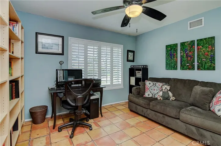Good space for any office configuration...nice plantation shutters and fan here too...