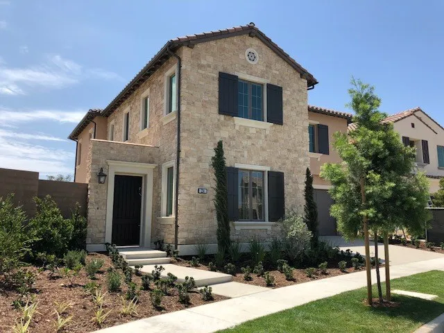 Front View of this Tuscan style Traditional Home, Look at all the space on the Right side !