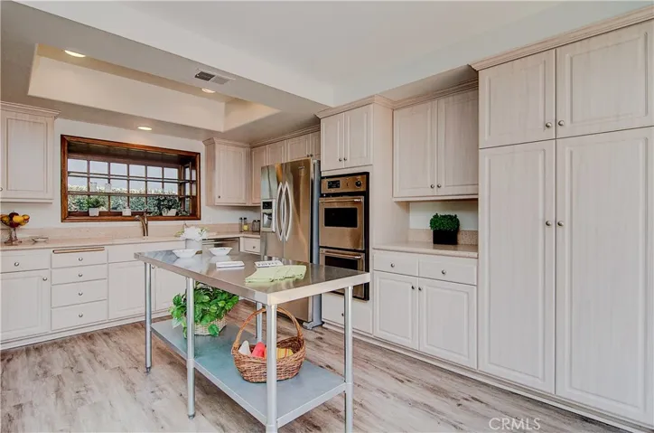 Any chef will love this remodeled kitchen with loads of cabinet and prep space.