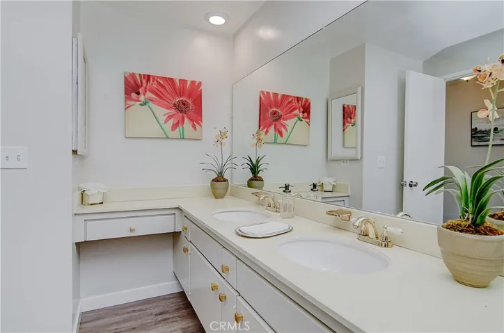 Large double sink vanity has plenty of storage...plus extra dressing space in this bath.