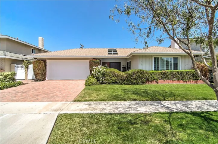 Popular Mid Century details and deep setback from street create curb appeal...beautiful paverd driveway too!
