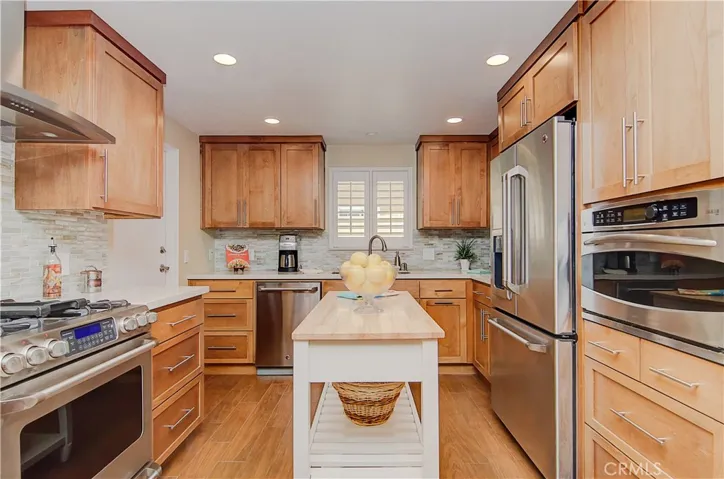 WOW is right...awesome kitchen with plenty of cabinet and prep space, stainless appliances, quartz counters...plus wine fridge!