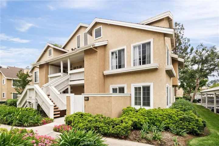 Single level, ground level with private patio and gated entry. Windows all around, with plantation shutters. Very green and well kept mature grounds. Jacaranda trees are blooming all over Woodbridge with their purple flowers.
