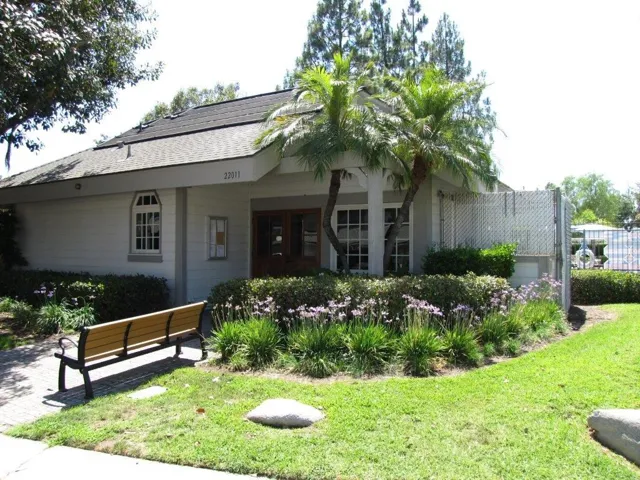 ONE OF TWO CLUB HOUSES ADJACENT TO ONE OF THE TWO POOLS.