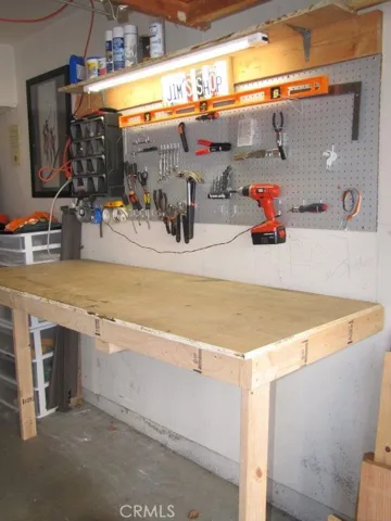 CUSTOM MADE WORK BENCH FOLDS UP AGAINST THE WALL AND OUT OF THE WAY WHEN NOT IN USE!