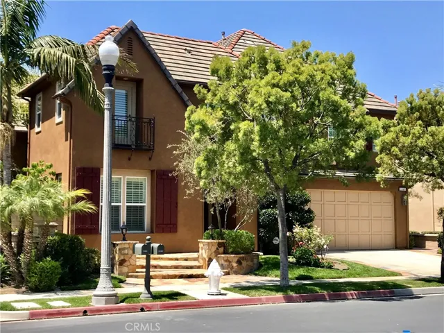 Front of the house, beautiful curb appeal and stone step entry and balcony off guest bedroom