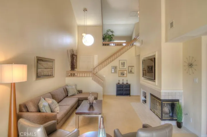 This is a GREAT room...multiple seating areas, fireplace and DRAMA!