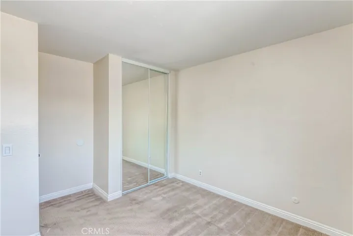 Up stairs, 2nd bedroom with mirrored closet