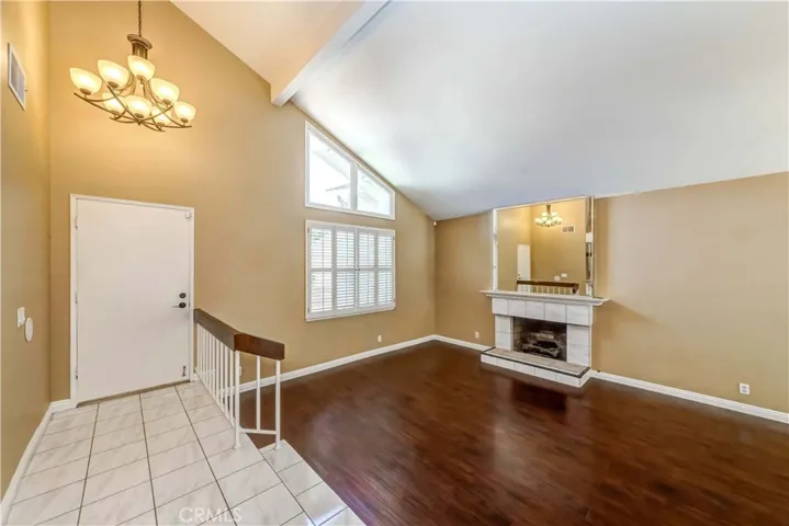 Entrance. Vault ceiling living room with fireplace