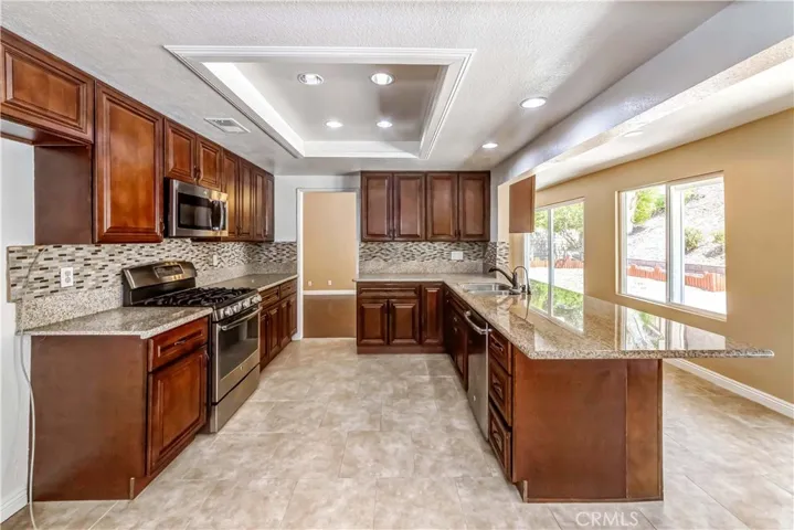 Remodeled kitchen with granite counter, flash backs. newer stainless appliances