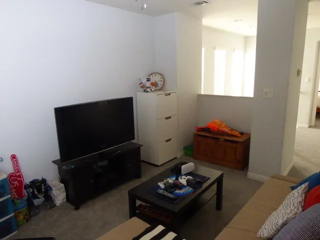 Currently, this 3rd bedroom serves as a den. There is no closet