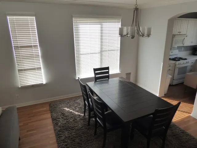 Dining area is adjacent to the living room and kitchen