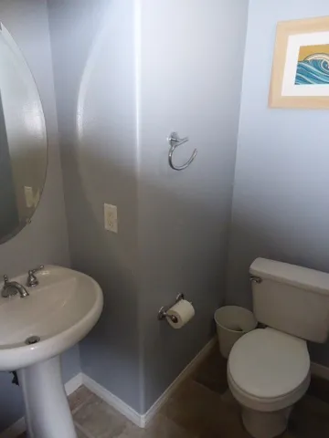 Guest half bath is located on entry level