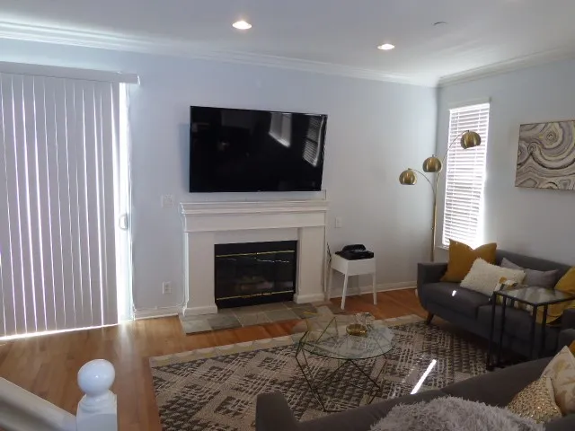 Hardwood floors, fireplace, loads of natural light in the spacious living room