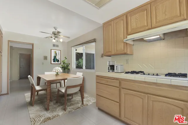 Virtually staged furniture in kitchen/breakfast area