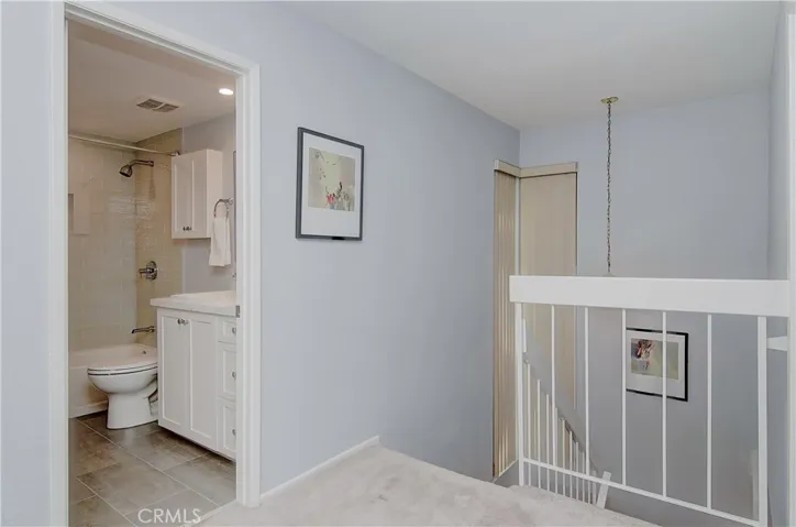 Upstairs foyer makes for easy transition between the two levels and all of the upstairs rooms.