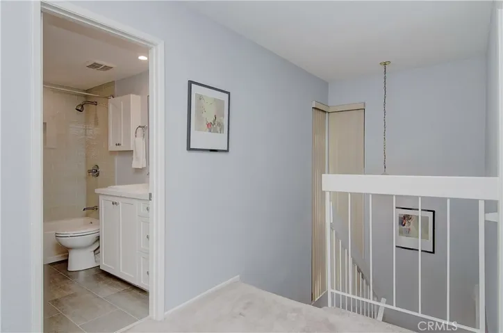 Upstairs foyer makes for easy transition between the two levels and all of the upstairs rooms.