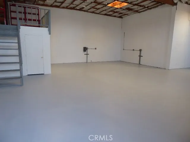 Mezzanine area sits above the half bath and storage closet