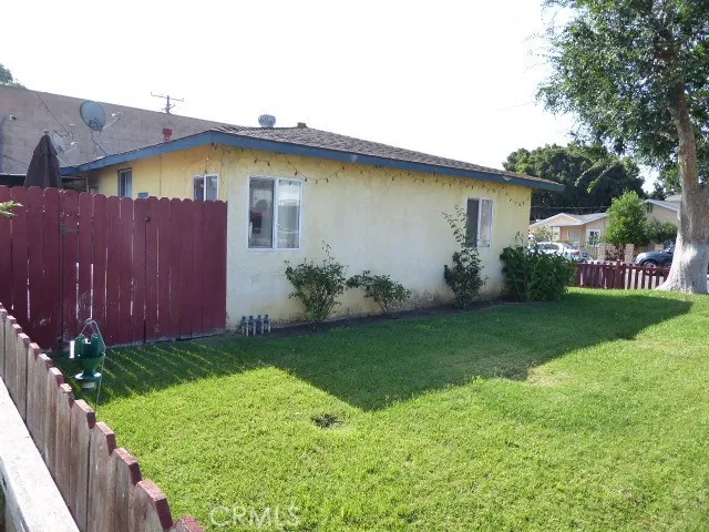 Rear of house area has a deck and is fenced and gated on all sides